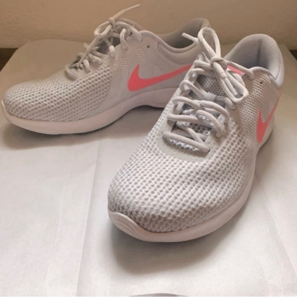 Never worn NIKE Revolution Pure Platinum Women’s